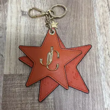 JIMMY CHOO 오렌지 별 모양 키링