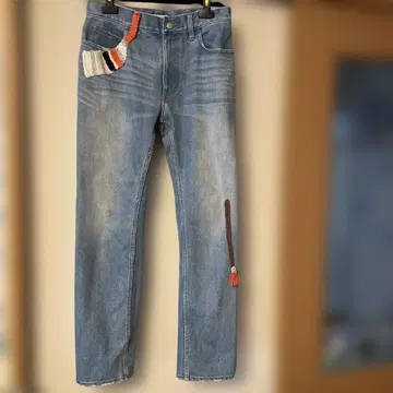 츠모리치사토 자수 포켓 부착 데님 팬츠