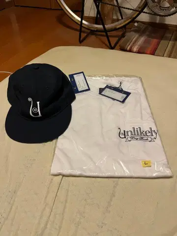 Unlikely x 네펜데스 티셔츠 캡 세트