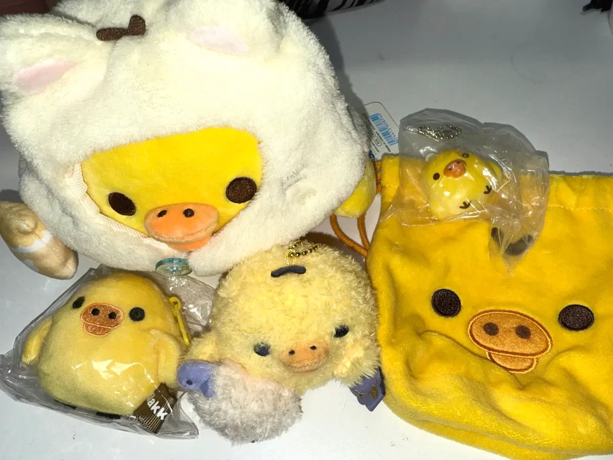 산엑스 리락쿠마 키이로이토리 인형 네코네코노유 온천 파우치 스퀴시 가챠