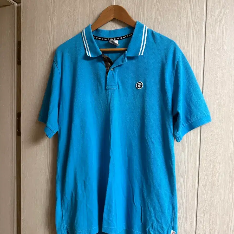 베이프(AAPE) 원포인트 로고 PK 카라 반팔티 (스카이블루)