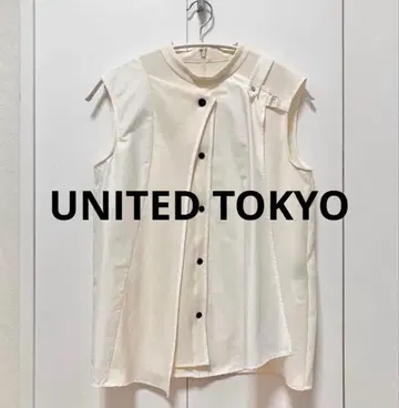 UNITED TOKYO 플레어 앙루트 슬리브리스 블라우스 (아이보리)