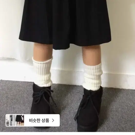 묘랑 주쿠 스웨이드 미디 스커트 블랙