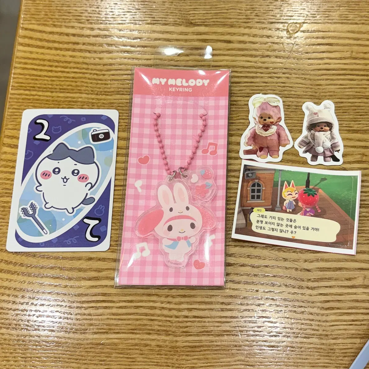 하치와레 우노 카드 + 마이멜로디 아크릴 키링 + 몬치치 조각 스티커