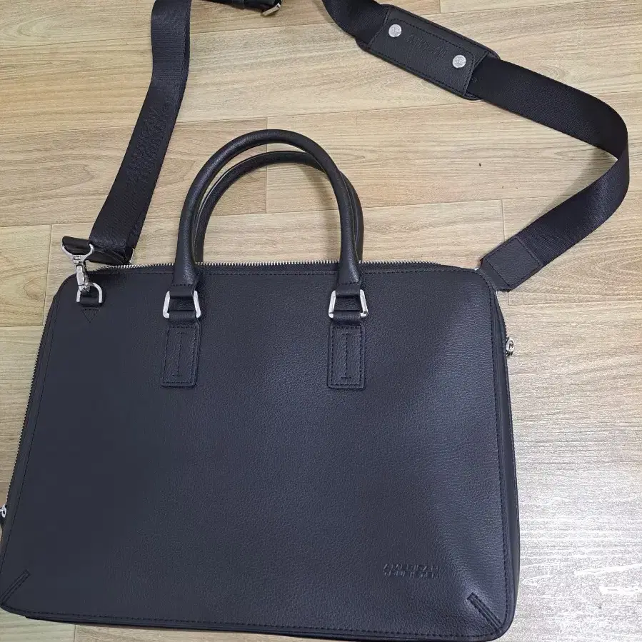 아메리칸투어리스터 가죽 브리프케이스