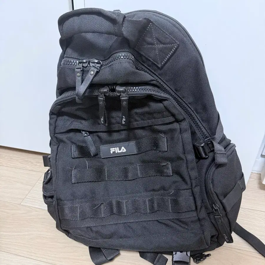 휠라 백팩책가방