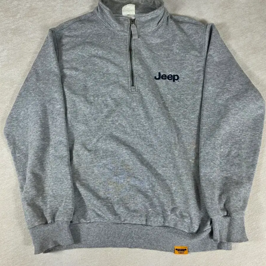 지프(JEEP) 백프린팅 루즈핏 하프집업 맨투맨