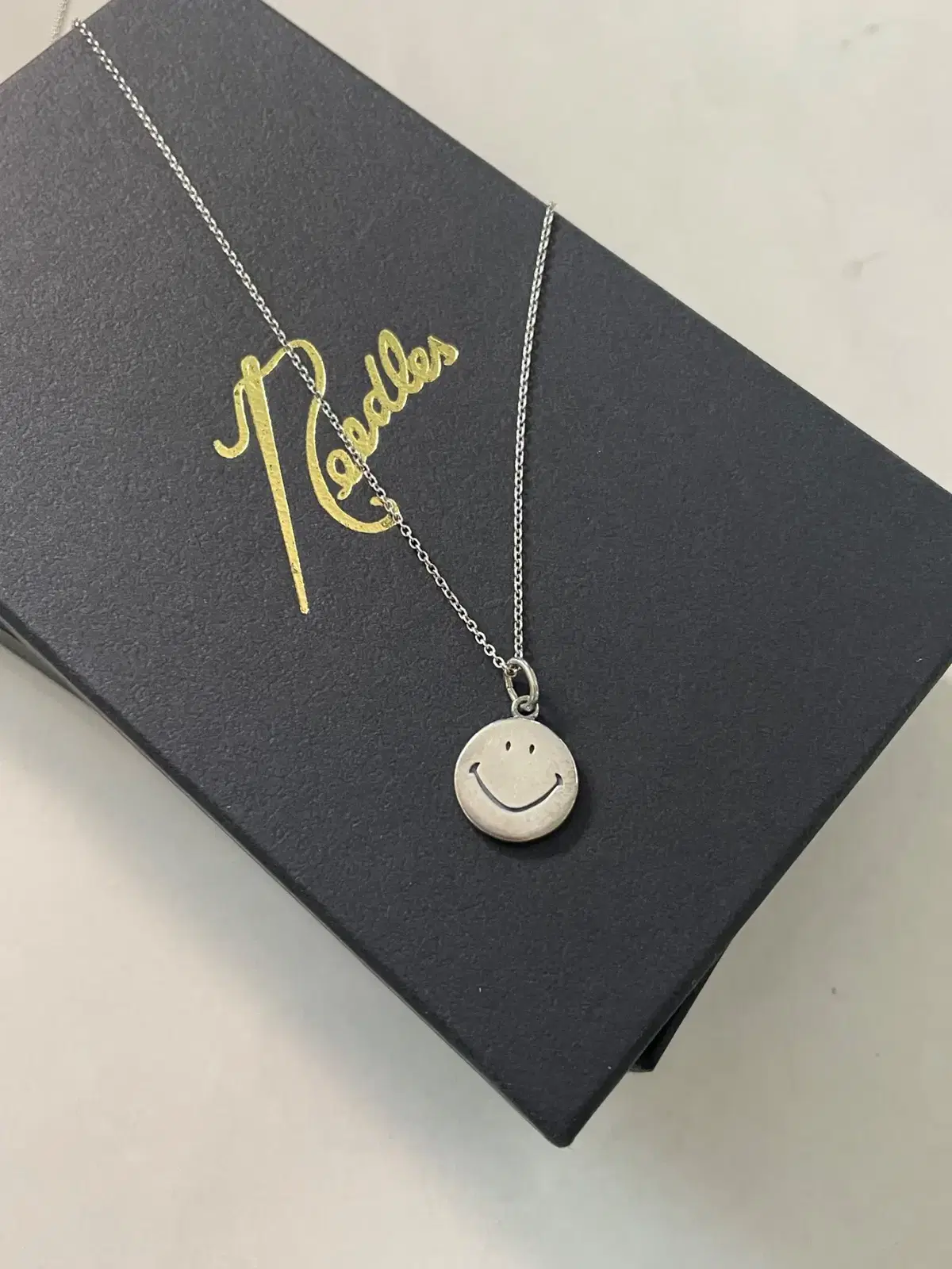 Needles 니들스 smile pendent necklace