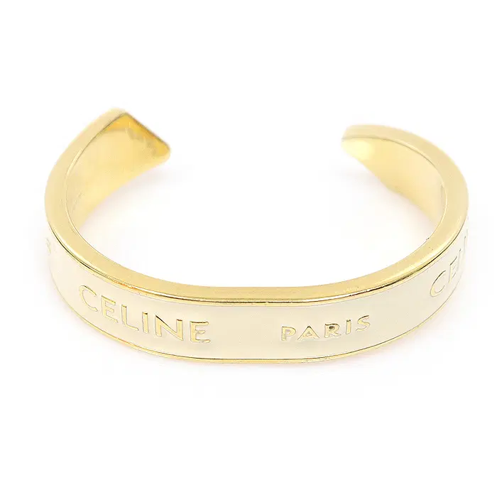 Celine(셀린느) B107C3F68.01IG 아이보리 골드 에나멜 리본 스몰 커프 여성팔찌 CO29645CE