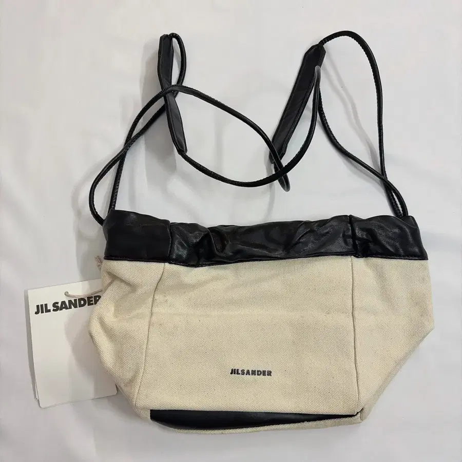 질샌더(Jil Sander) 드로스트링 캔버스 숄더백