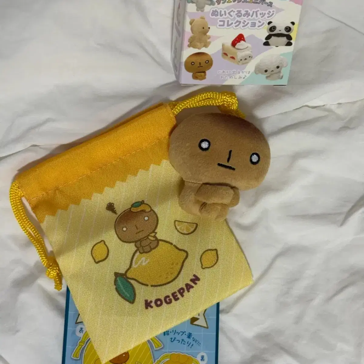 일괄) 산엑스 유니버스 코게빵 탄빵 랜덤 3종 (인형 뱃지, 조리개 파우치, 점보 스티커)