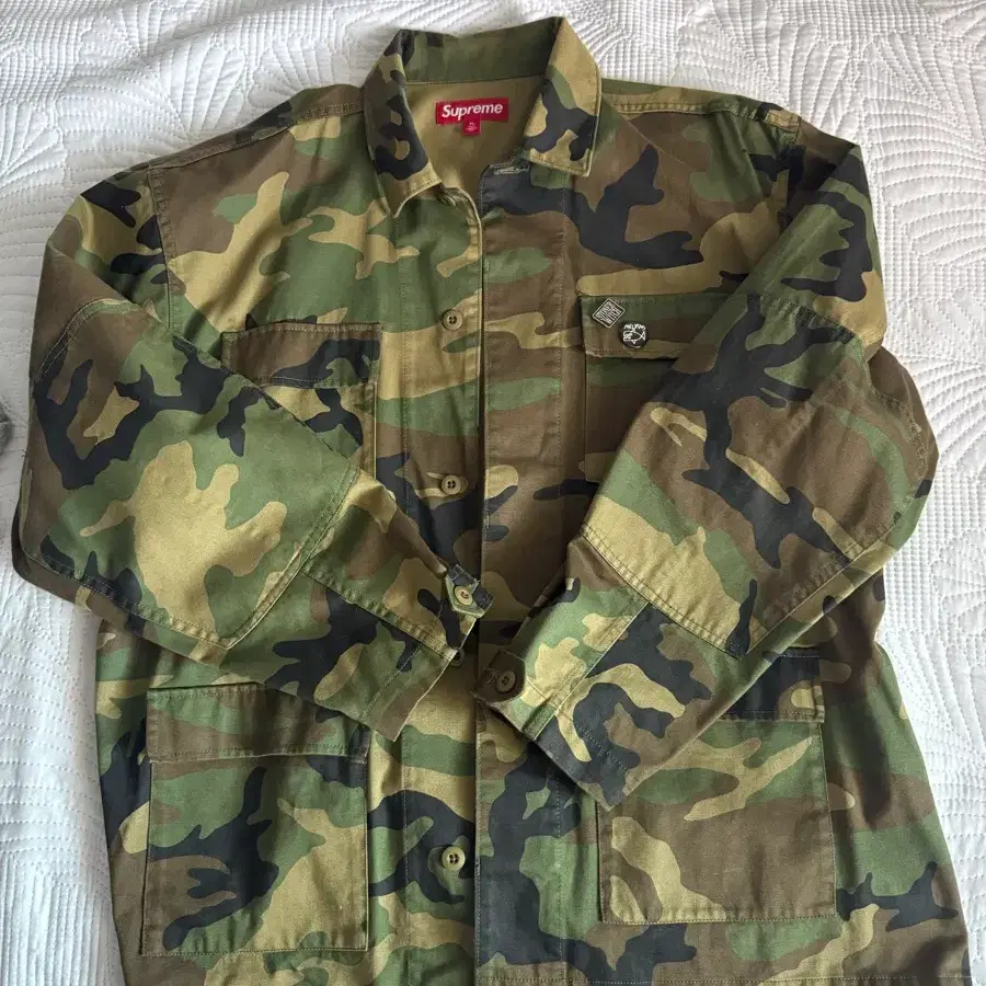 [XL] 슈프림 x 멜빈스 BDU 자켓 우드랜드 카모 - 24SS