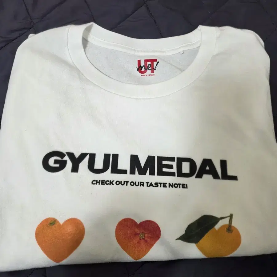 유니클로 귤메달 GYULMEDAL 화이트 티셔츠