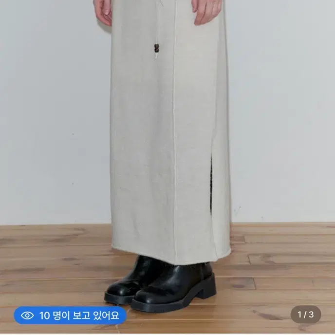 [새]티메이커 스커트 ASYMMETRIC SLIT KNIT MIDI SKIRT