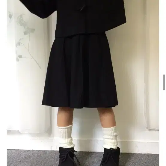 묘랑 주쿠 스웨이드 미디 스커트 블랙 검정