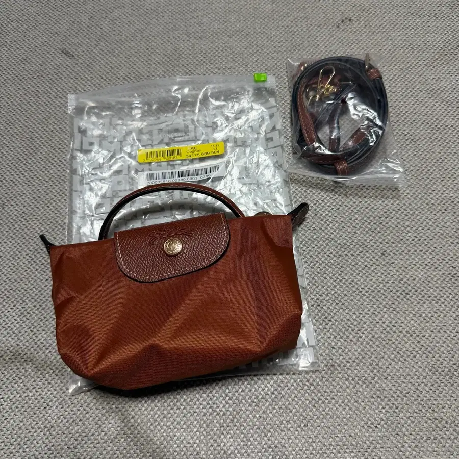 롱샴 르 플리아쥬 오리지널 미니 파우치 (새상품,스트랩 포함)