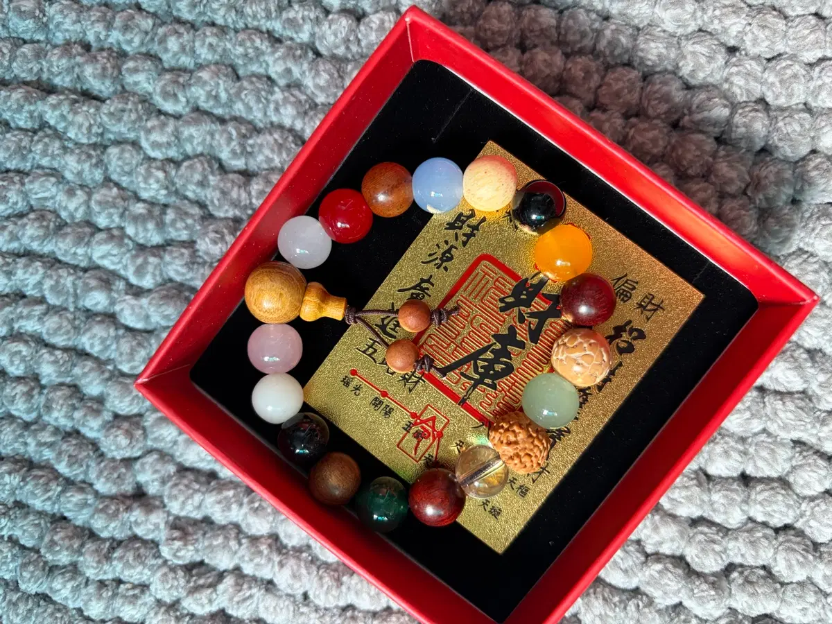 Various gemstone bracelets with designs that bring good fortune