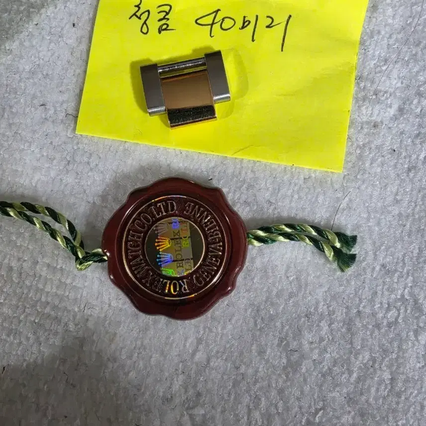 ロレックス 時計ライン40mm保証メダル