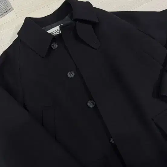 어나더오피스 24fw 보이저 발마칸 코트 블랙 01