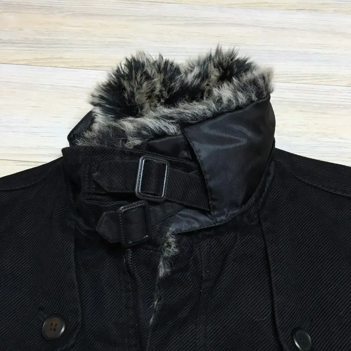 [Shown here] A fur turtleneck coat.