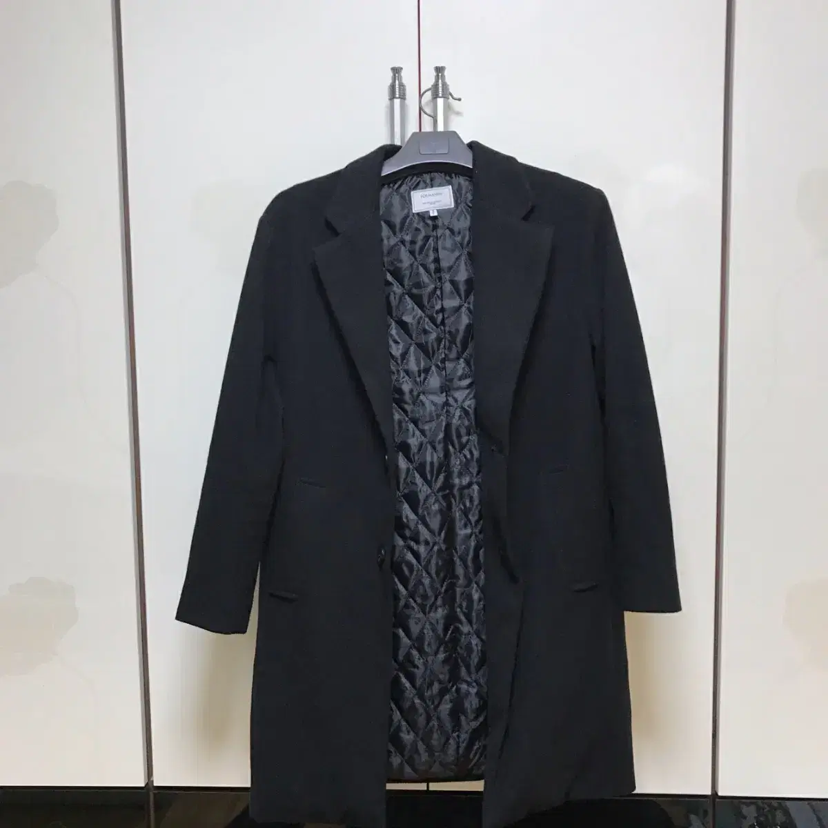 Quilted wool black long coat